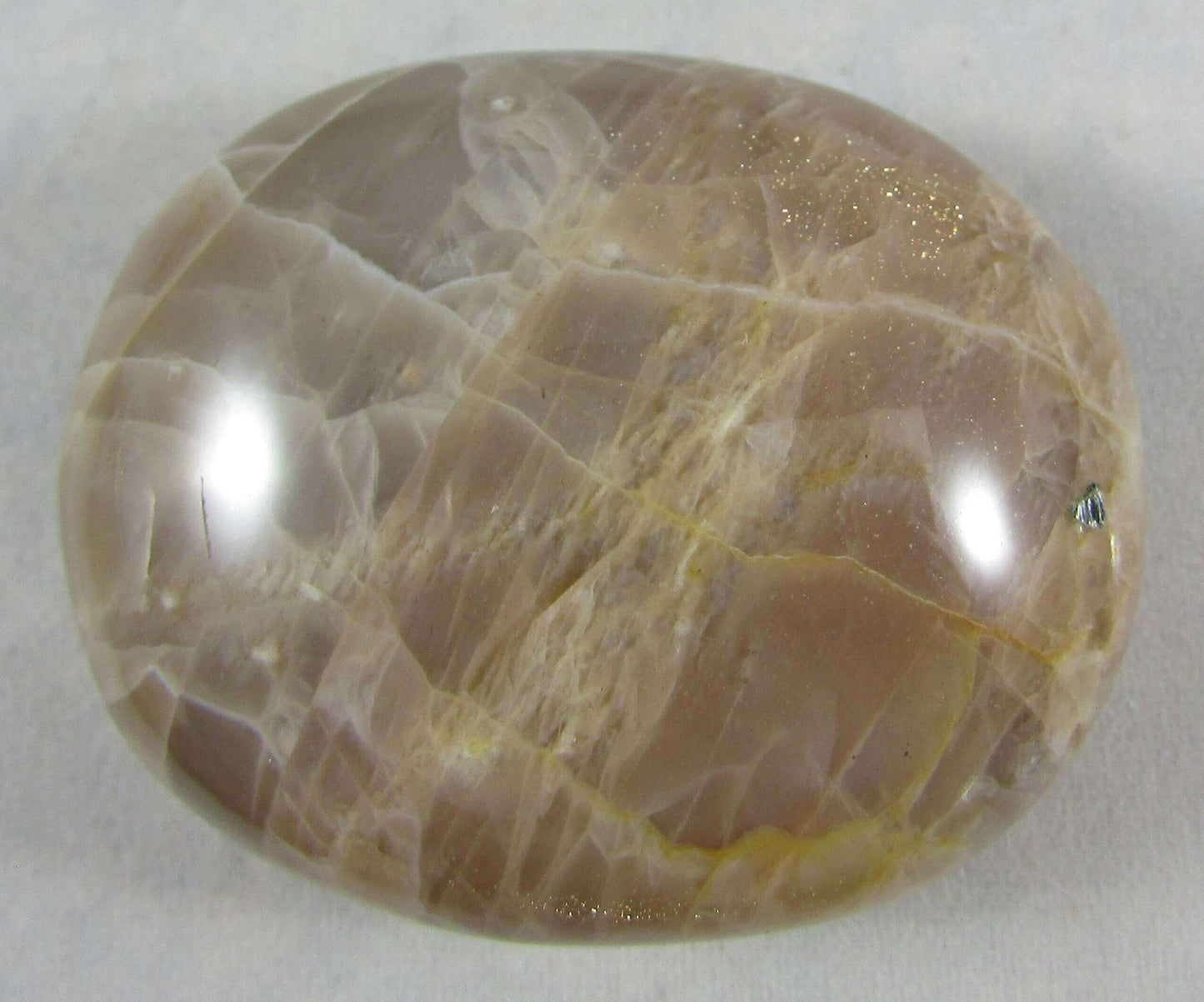 peach moonstone crystal palmstone, worry stone, madagascar