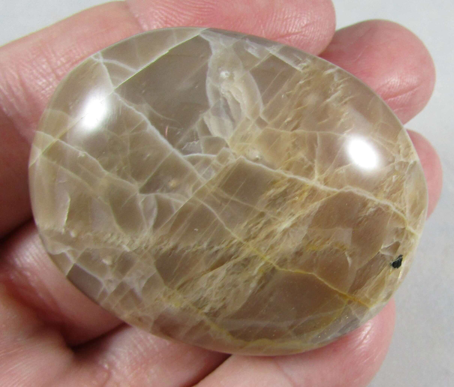 peach moonstone crystal palmstone, worry stone, madagascar