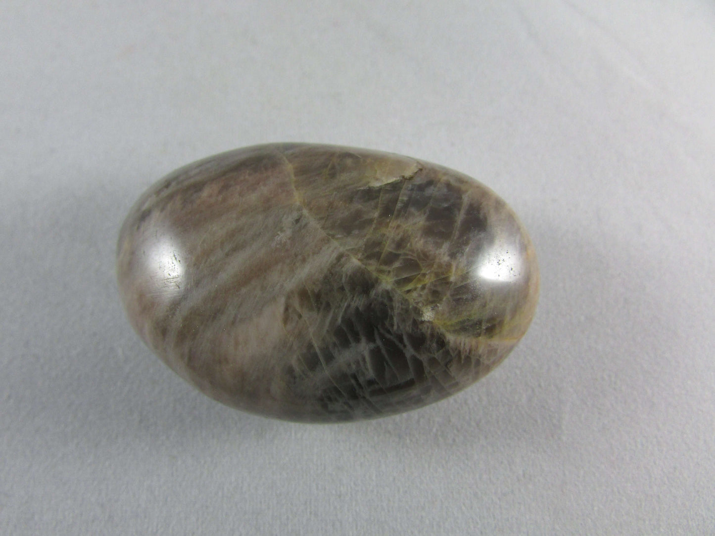 black moonstone crystal palmstone, worry stone, madagascar