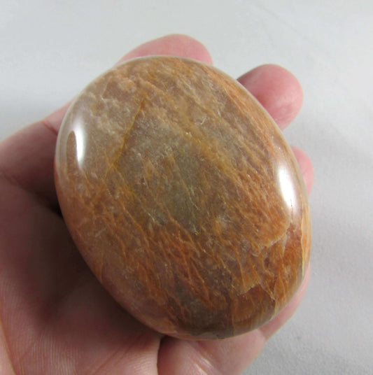 peach moonstone crystal palmstone, worry stone, madagascar