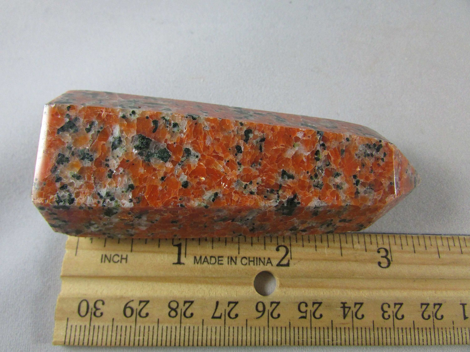 orchid calcite crystal pillar, orange and black calcite