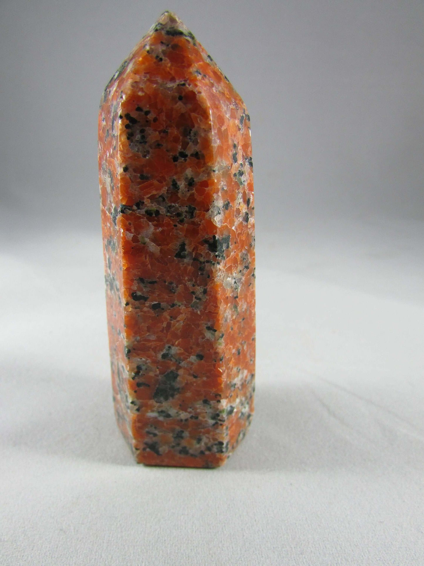 orchid calcite crystal pillar, orange and black calcite