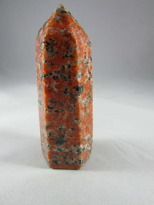 orchid calcite crystal pillar, orange and black calcite