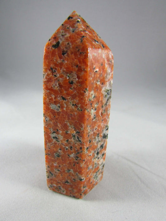orchid calcite crystal pillar, orange and black calcite