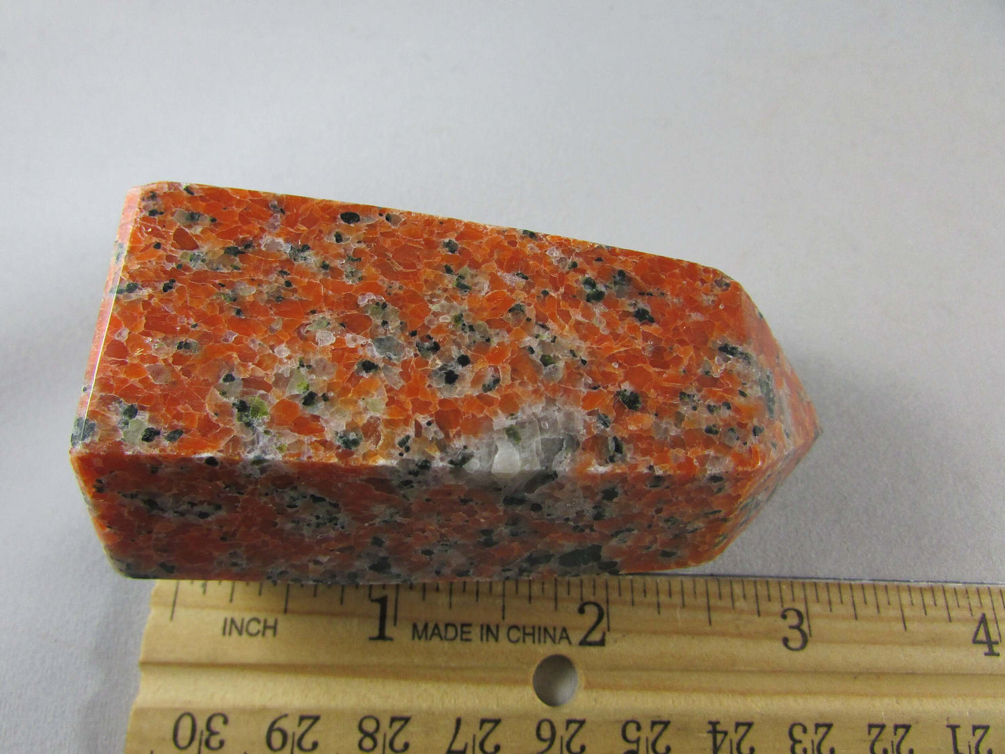 orchid calcite crystal pillar, orange and black calcite