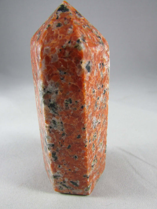 orchid calcite crystal pillar, orange and black calcite