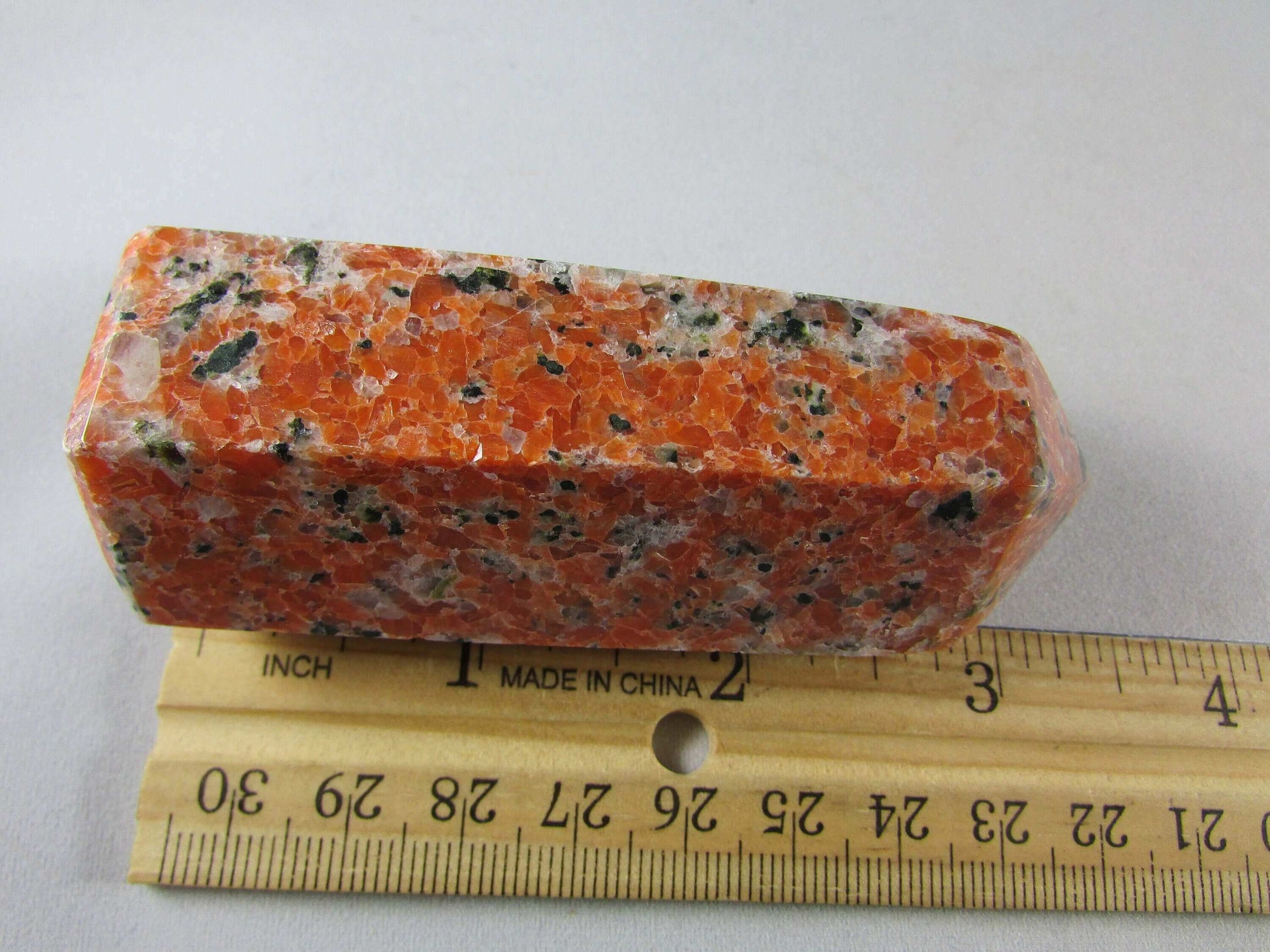 orchid calcite crystal pillar, orange and black calcite