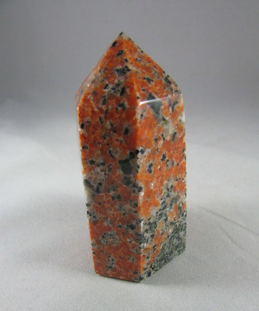 orchid calcite crystal pillar, orange and black calcite