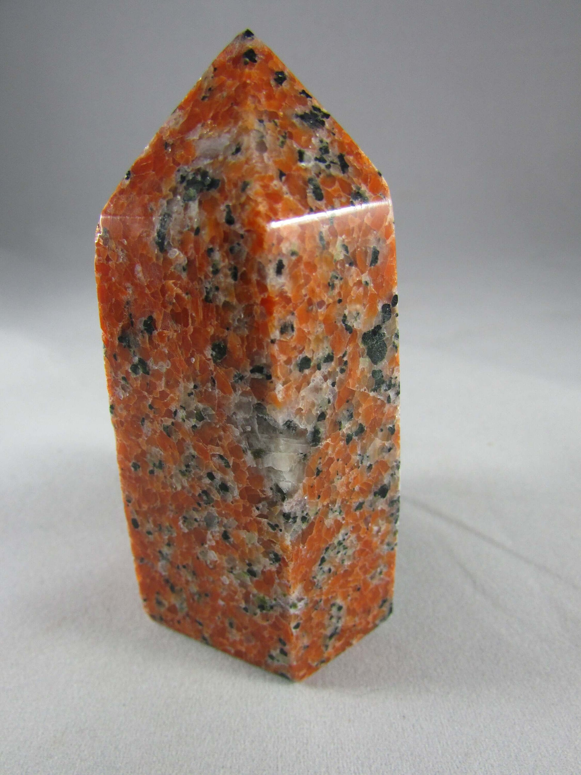 orchid calcite crystal pillar, orange and black calcite