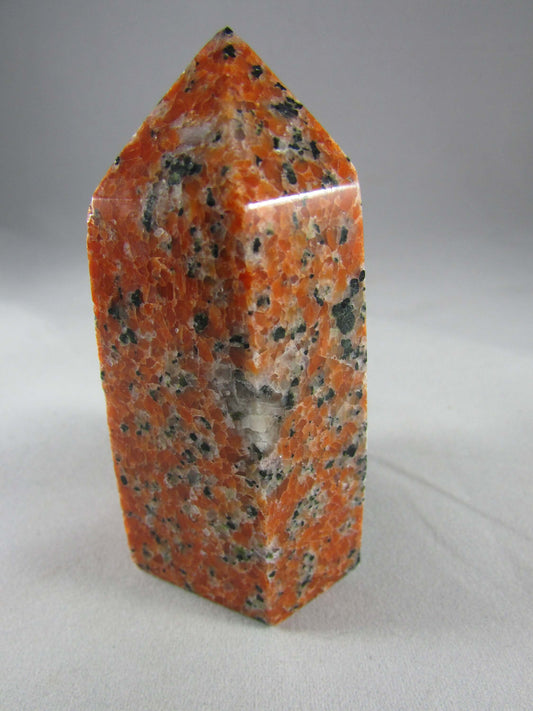 orchid calcite crystal pillar, orange and black calcite