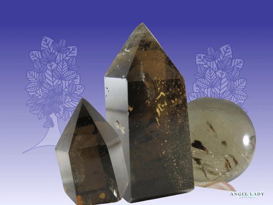 Smoky Quartz points and sphere arranged together, offering grounding and energetic protection for empaths and sensitive healers.