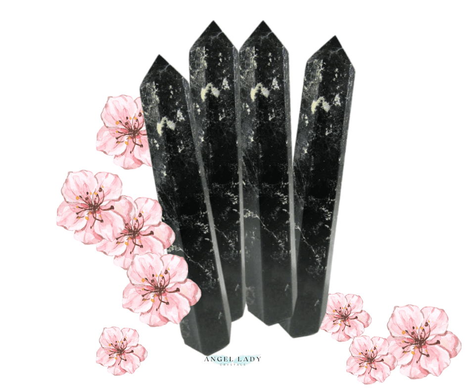 plum blossom jasper obelisks with pink plum blossoms in the background
