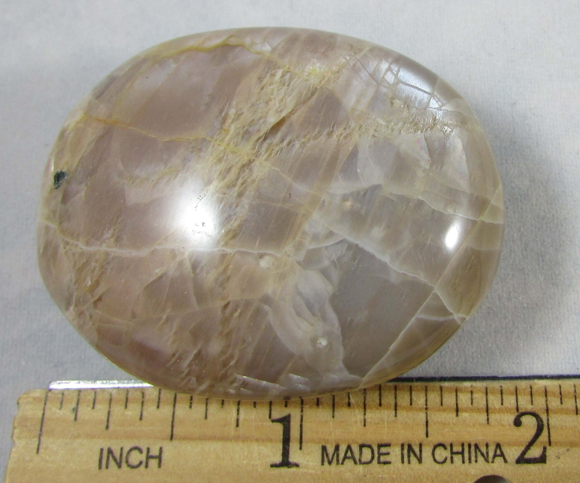peach moonstone crystal palmstone, worry stone, madagascar