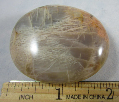 peach moonstone crystal palmstone, worry stone, madagascar