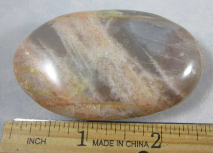 peach moonstone crystal palmstone, worry stone, madagascar