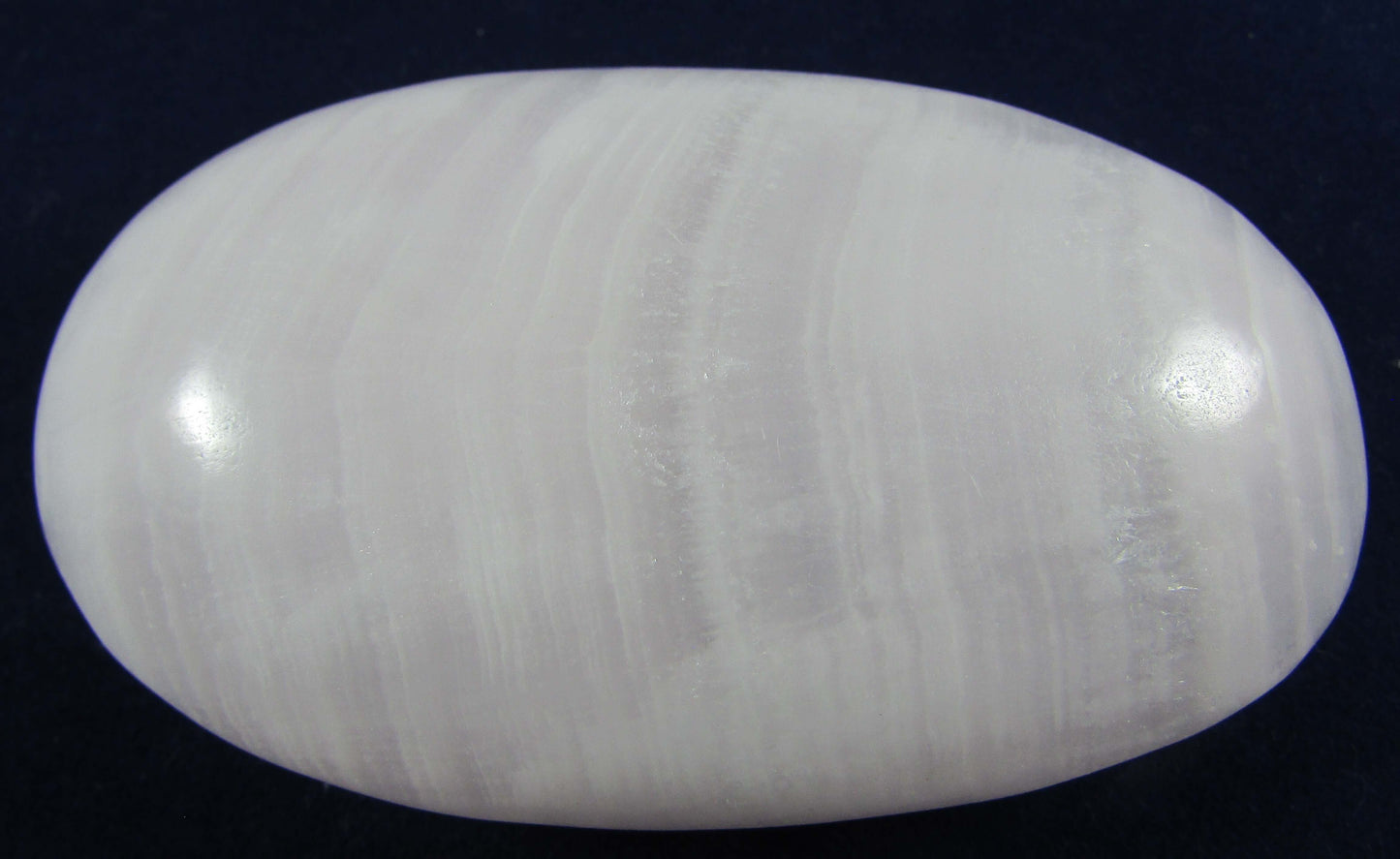 mangano calcite crystal sphere, polsihed palmstone