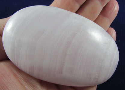 mangano calcite crystal sphere, polsihed palmstone