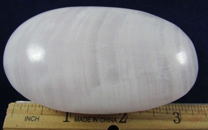 mangano calcite crystal sphere, polsihed palmstone