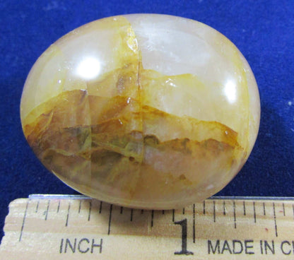 Golden Healer Crystal palmstone polished madagascar crystal