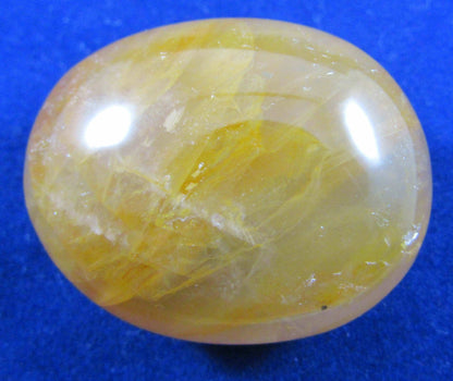 Golden Healer Crystal palmstone polished madagascar crystal