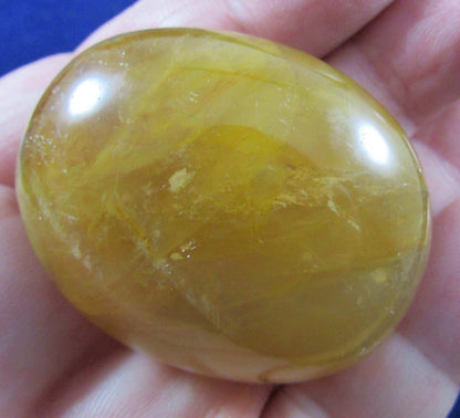 Golden Healer Crystal palmstone polished madagascar crystal