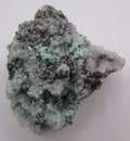 A natural mineral specimen of Aurichalcite Aragonite on Copper with a rugged texture, predominantly gray and white with hints of blue.