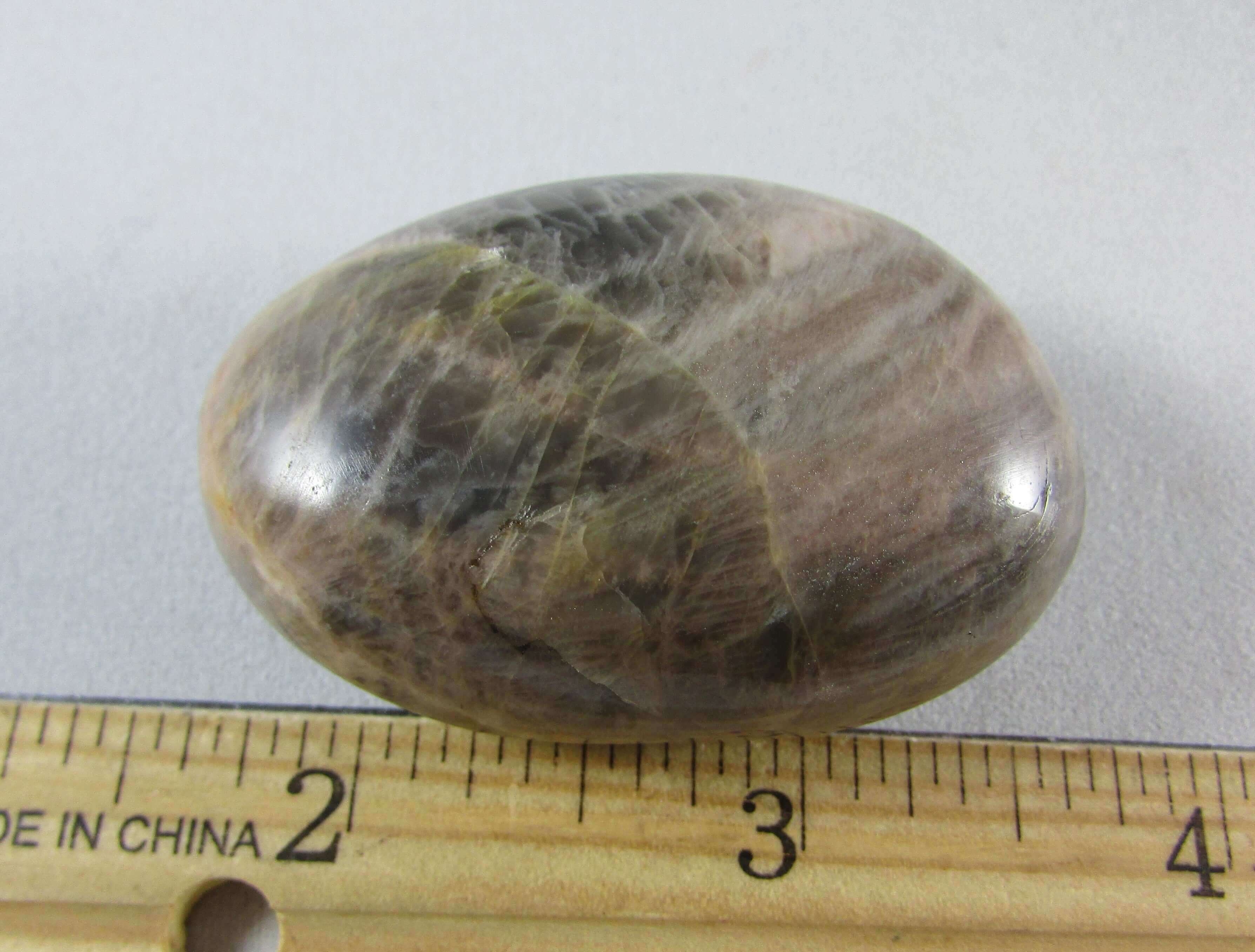 black moonstone crystal palmstone, worry stone, madagascar