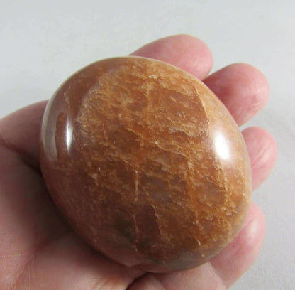 peach moonstone crystal palmstone, worry stone, madagascar