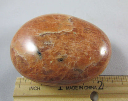 peach moonstone crystal palmstone, worry stone, madagascar