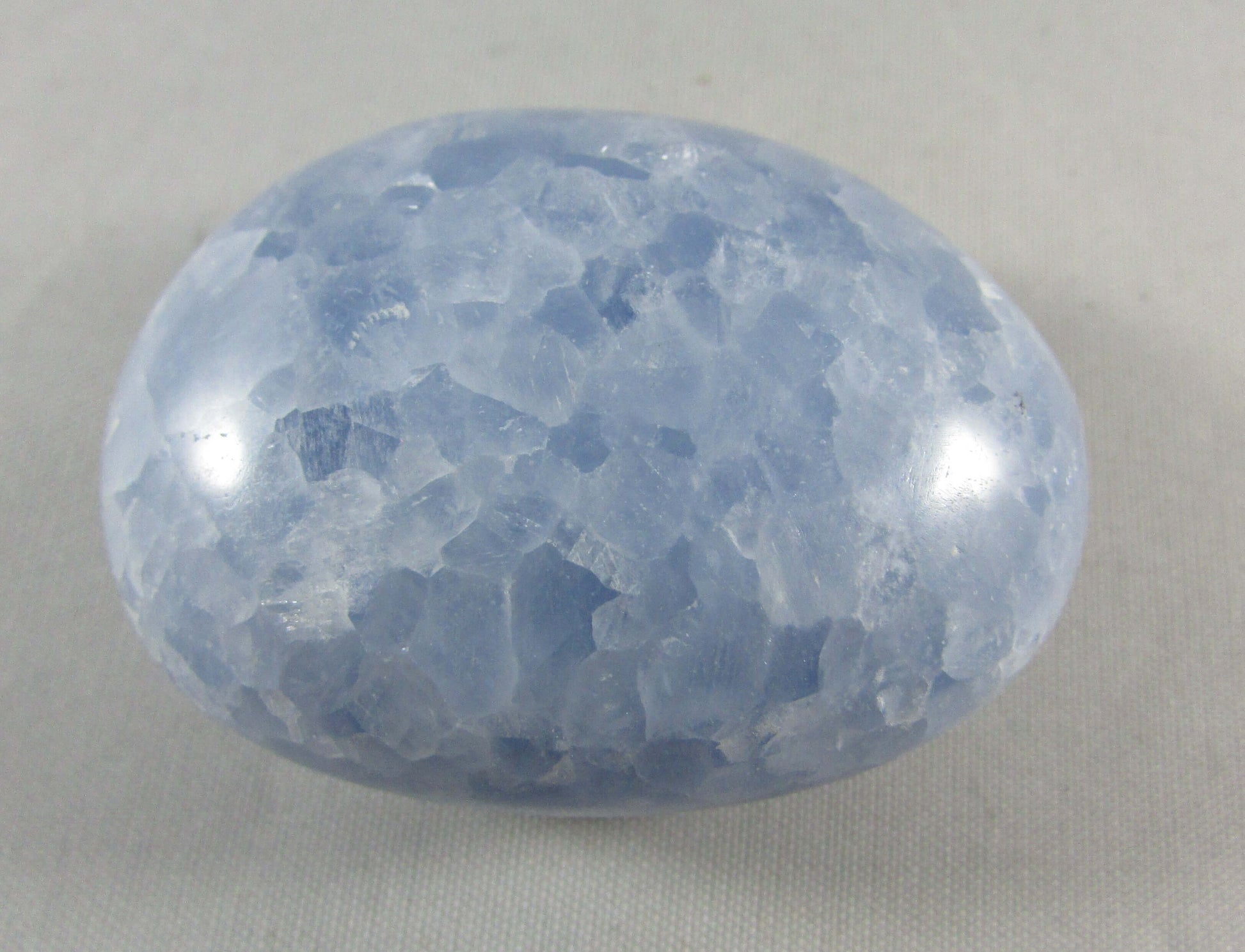 blue calcite crystal palmstone, polished worry stone