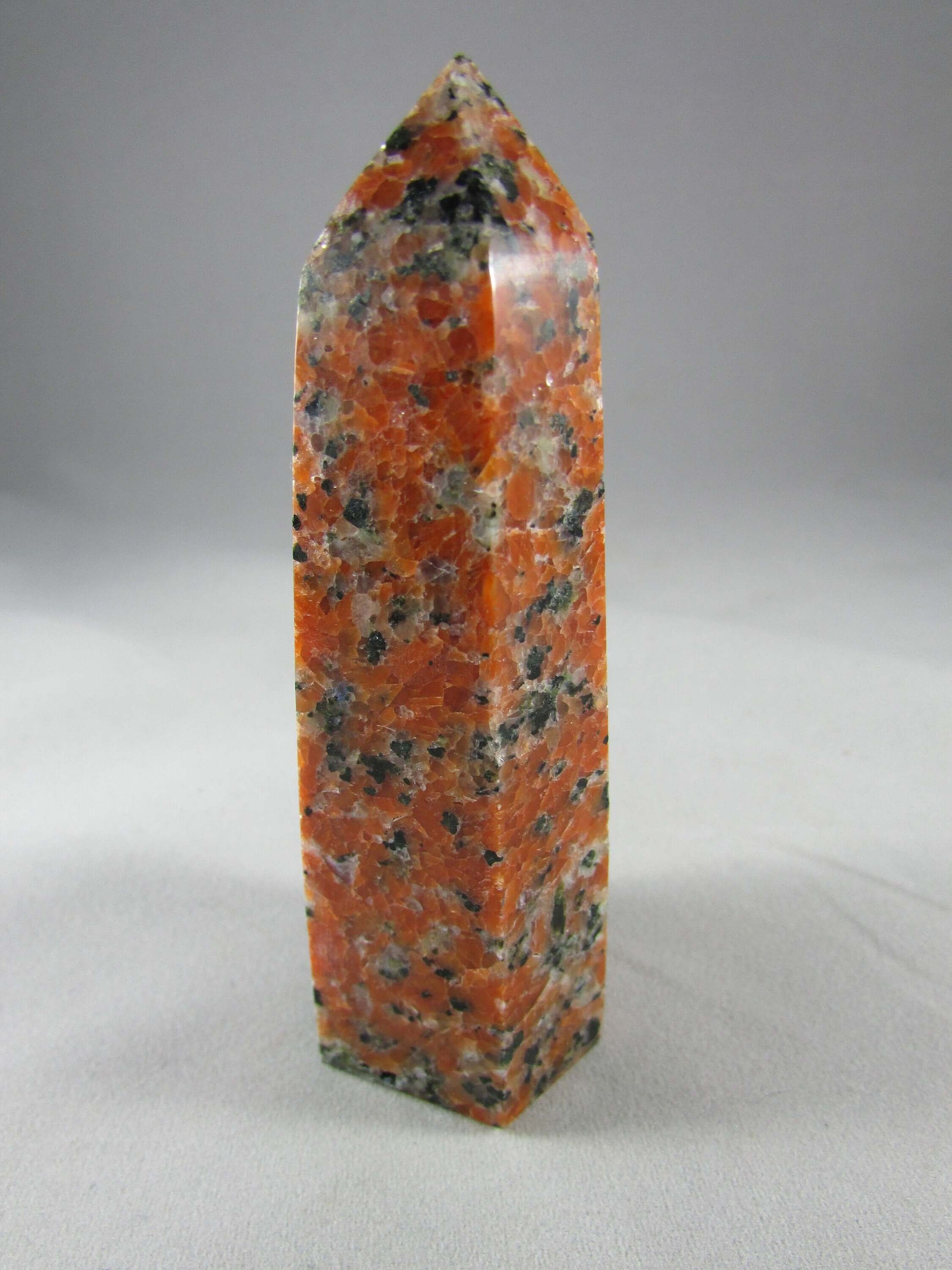 orchid calcite crystal pillar, orange and black calcite