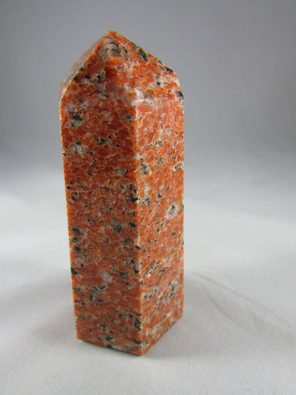 orchid calcite crystal pillar, orange and black calcite