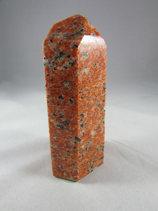 orchid calcite crystal pillar, orange and black calcite
