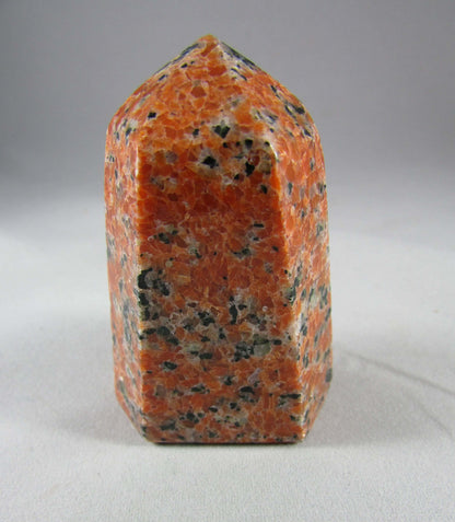 orchid calcite crystal pillar, orange and black calcite