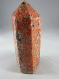 orchid calcite crystal pillar, orange and black calcite