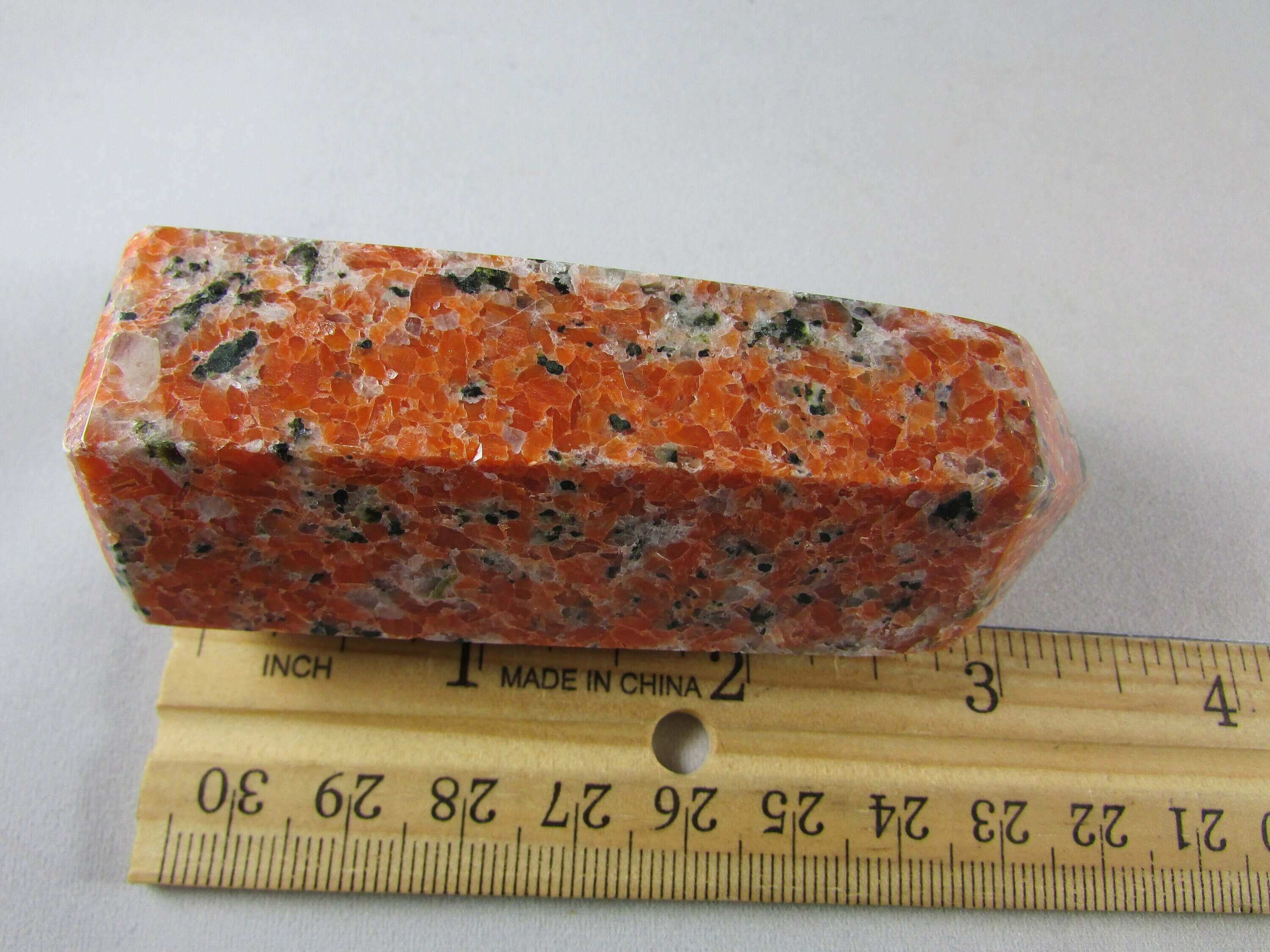 orchid calcite crystal pillar, orange and black calcite